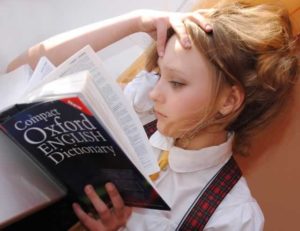 Girl studying the Oxford English Dictionary